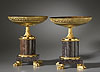 A very fine pair of Empire gilt bronze and porphyry coupes